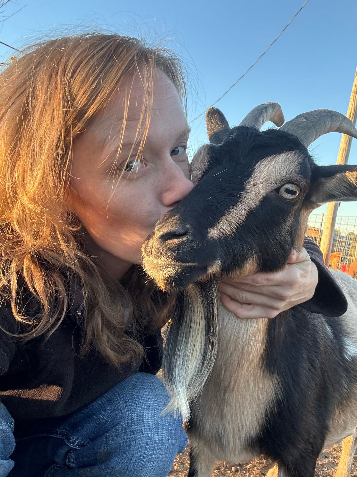 DeNora giving one of our goats a kiss